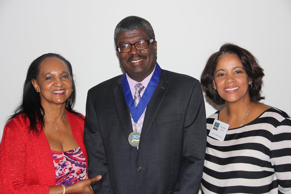 Alton Palmore standing with Bobbie Howard Davis and Michelle Levy